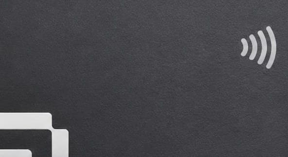 The NFC symbol on the front of the Qshot Metal Card